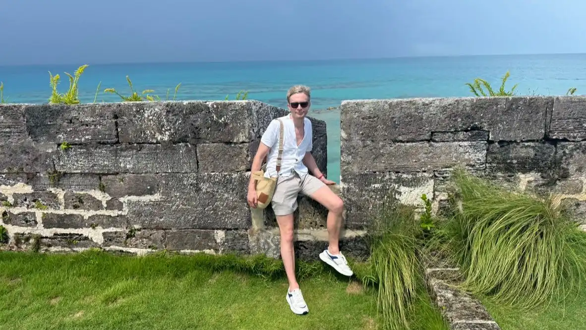 Joe sat on the wall at the Royal Naval Dockyard in Bermuda