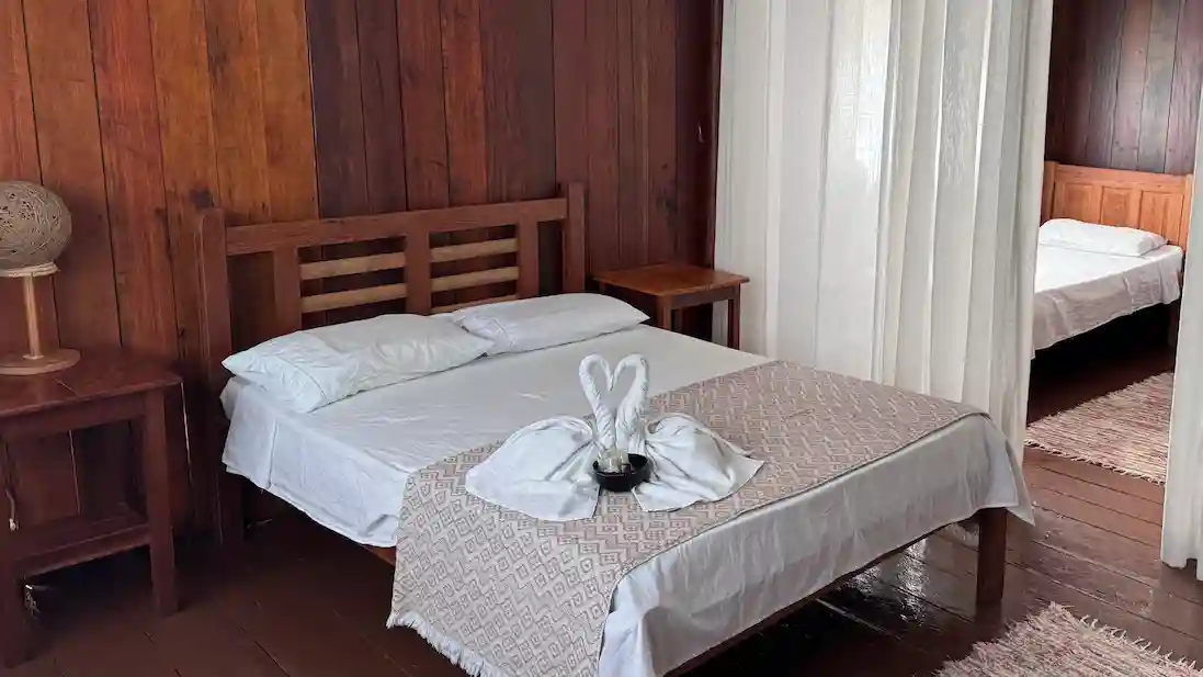 The tripple bedroom at Tupana Lodge with a towel animal