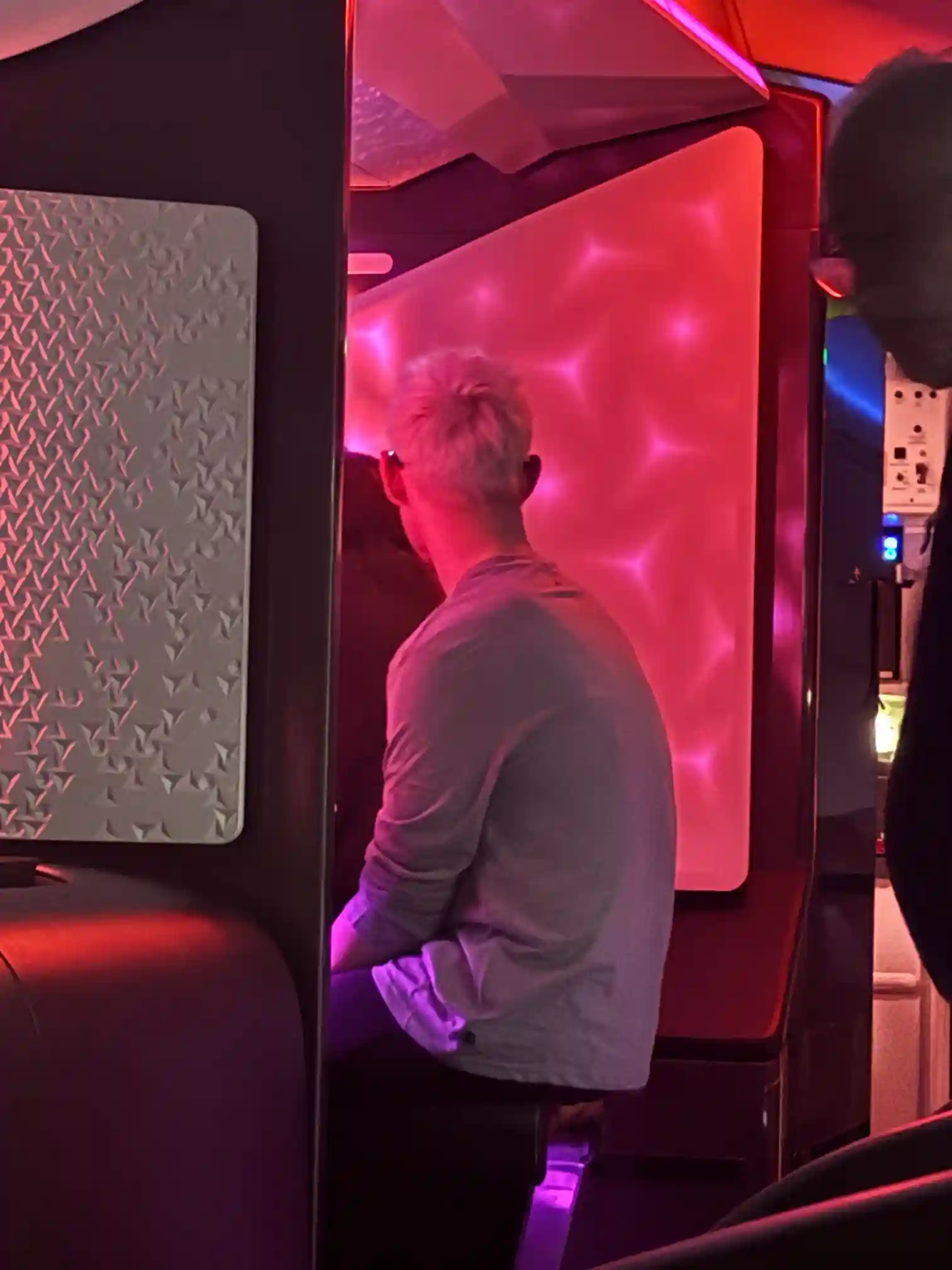 Alex sat at the onboard bar on the Virgin 787 Upper Class flight to Cape Town