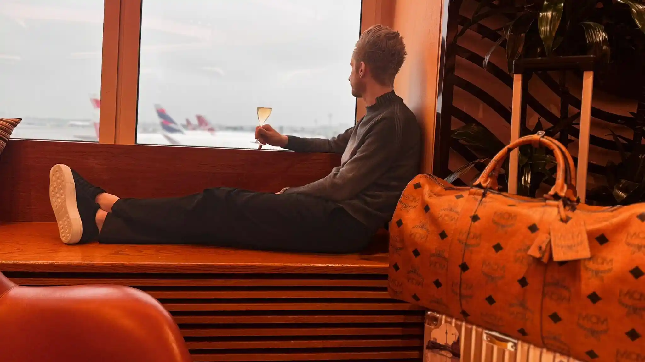 Joe sat looking out of the Virgin Clubhouse window onto the tarmac with a glass of champagne
