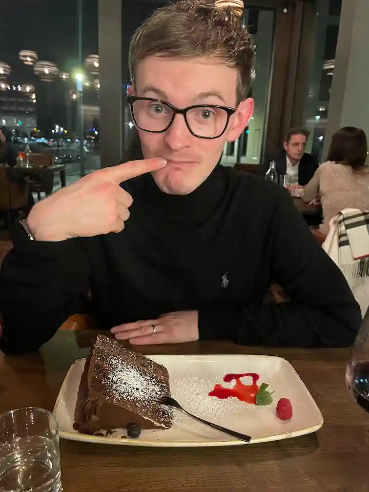Alex sat in the Ash steak resturant on New Years eve eating a massive chocolate cake Alex sat in the Ash steak resturant on New Years eve eating a massive chocolate cake