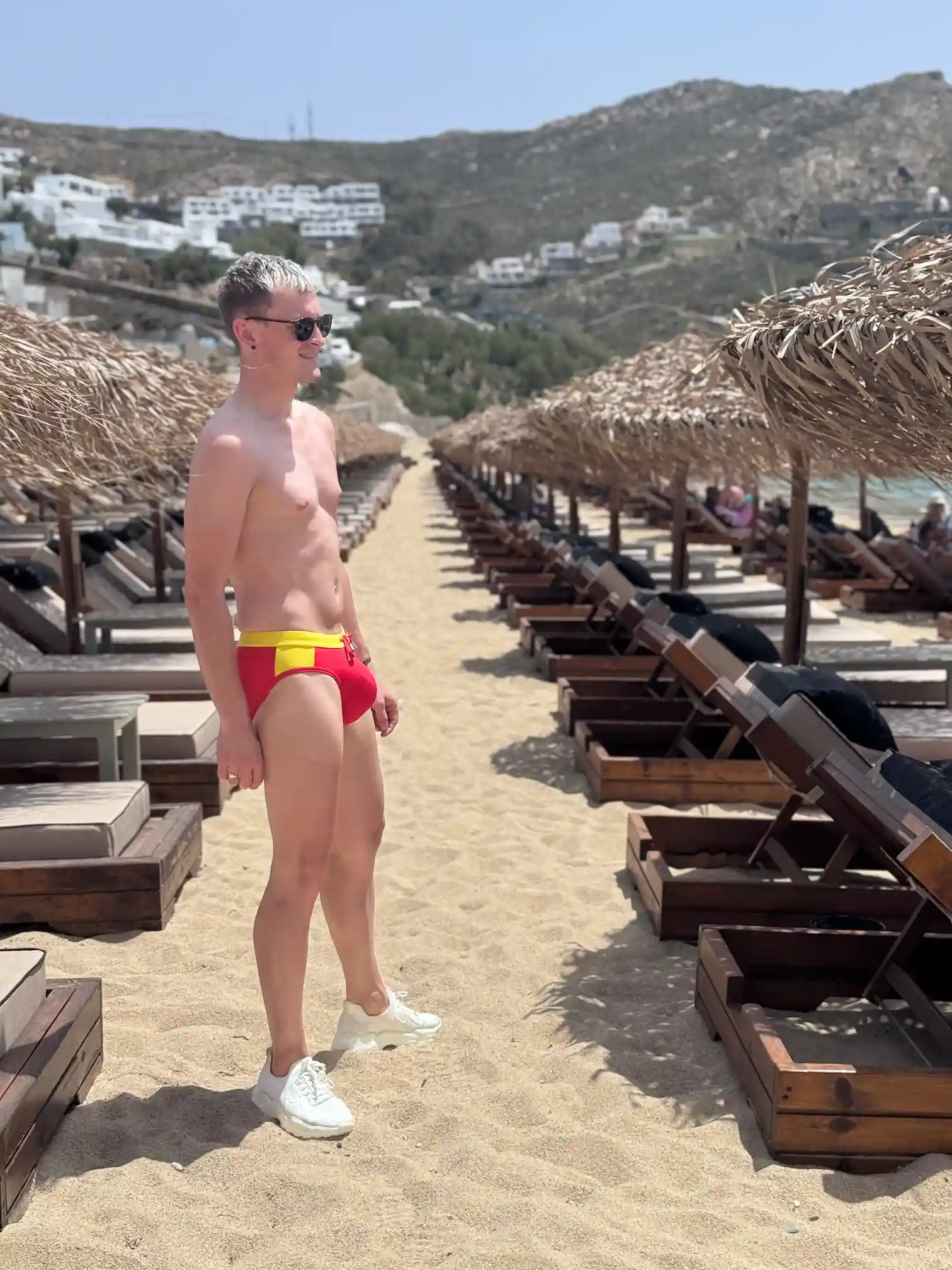 Alex in red speedos on the Elia Beach.